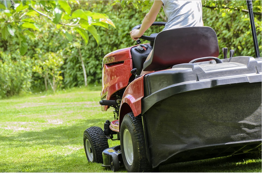 a man mowing a lawn